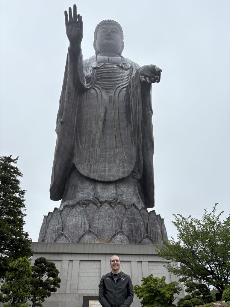 A photo of Jeremy Grifski at the Great Buddha in Ibaraki Prefecture (Ushiku Daibutsu).